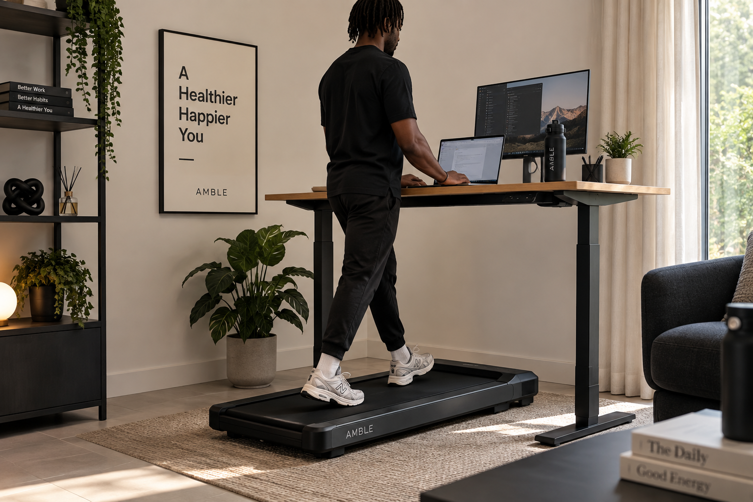 Man walking on AMBLE Go under a standing desk in a home office